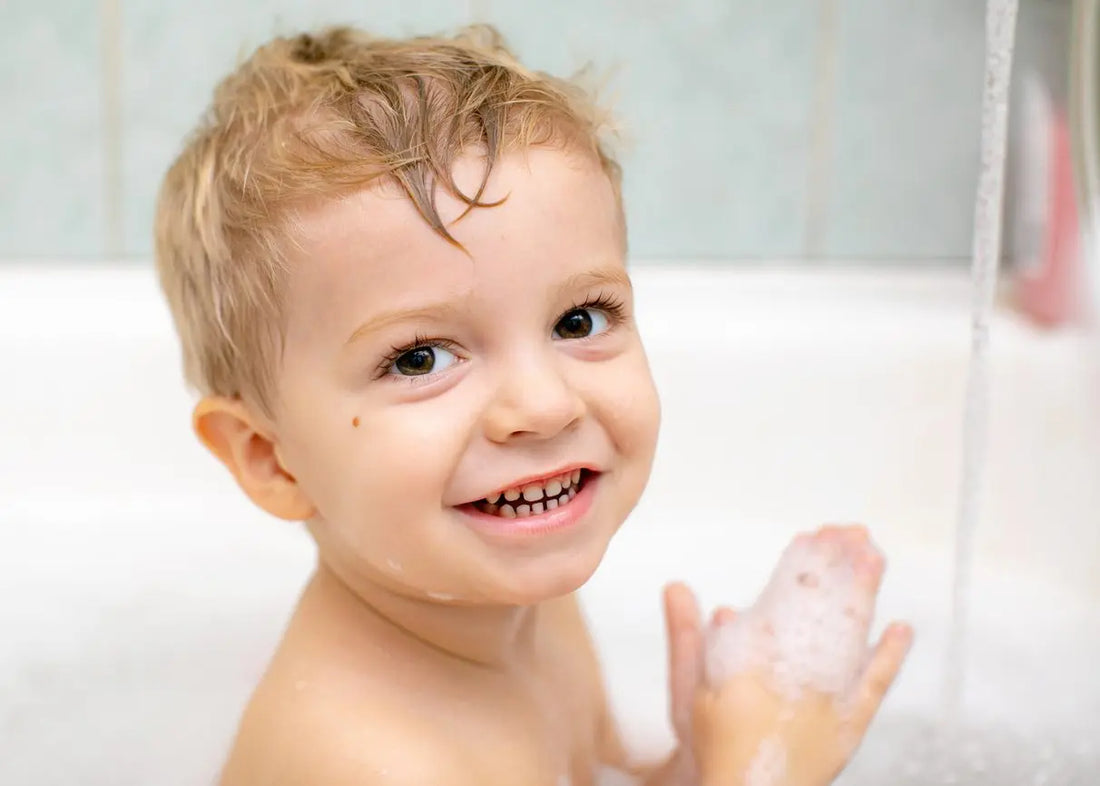 happy funny baby laughing and bathed in the bath